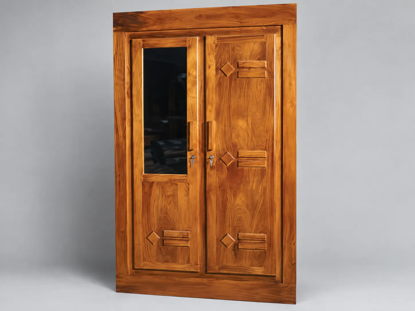 Kallingal Royal Multi-Shutter Wardrobe 20 - Ornate Teak Master Wardrobe Kallingal expansive multi-shutter teak wood wardrobe with intricate floral carving detail